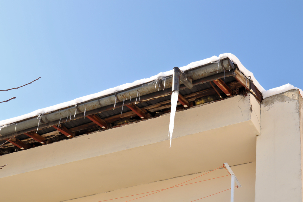 Frozen,Downspout.,Common,Issue,Your,Gutter,May,Encounter,During,Winter.